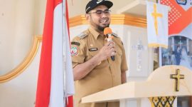 Bupati Halmahera Selatan Hasan Ali Bassam Kasuba saat Menyampaikan Sambutan di Kegiatan Nikah Massal. (Istimewa)